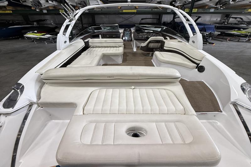 2015 Cobalt R7 rear sun pad with walkthrough to cockpit, showing plush white marine seating.