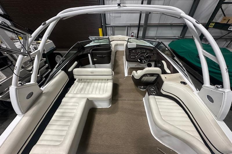 Interior layout of 2015 Cobalt R7 seen from stern, showing seating, helm, and open layout.
